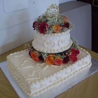 50Th Anniversary Cake Was driven all the way from Ontario to Ohio - made it there is one piece - white cake with buttercream icing and real roses!