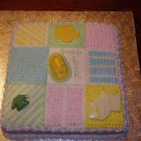 Baby Shower Marble cake with buttercream icing and white chocolate molded figures