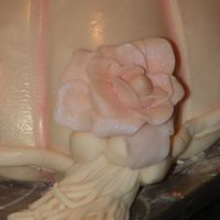 Detail Of One Of The Tassels I made the tassel by pressing fondant through my garlic press then topping with small beads & a fondant rose. The garlic press worked...