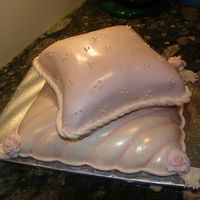 Pillow Cake This is a pillow cake I did for a baby's first birthday. The whole thing is brushed with pearl & luster dusts. Some colors I mixed...