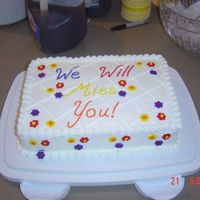 Going Away Party Cake I followed some advice I saw on this web site and made my flowers and words with royal icing. Unfortunately, one of the flowers must have...
