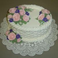 Janaes_Basketweave_Caketake2.jpg This was a chocolate cake with almond flavored buttercream. The violets were royal icing.