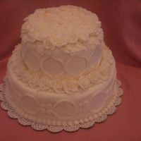 White Roses Interestingly enough, this was supposed to be a package cake with scroll work on the sides and a bow on top. Well, my bow loops didn't...