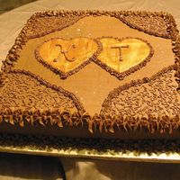 Golden Hearts This 14" raspberry chocolate cake was iced in chocolate buttercream with cornelli lace touches and gold painted fondant hearts