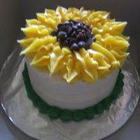 Sunflower white wedding cake with cream cheese icing...made for my dd came home from school for a couple days..I'm not sure who posted the...