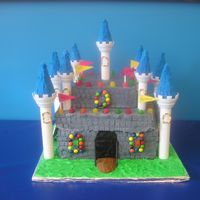 Castle this was a challenge! I originally covered it in fondant, but then the fondant was tearing & I couldn't get it to look right....so...