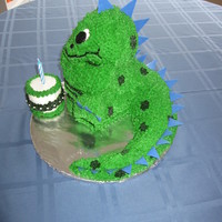 Dinosaur Got the idea from a Wilton cake book. Made for a first birthday, with small cake for smash cake.