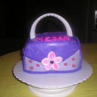 Purse Cake made for a co-worker; covered in bc, adorned with candies, handle is edge of plastic plate, flower is a big marshmallow cut with damp...