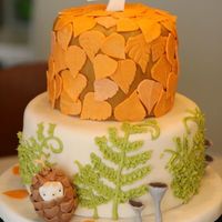 Fall Birthday Cake 6 and 9 inch cakes covered in fondant with fondant leaves and buttercream ferns. The ferns came out kind of blob-y; I guess I need more...