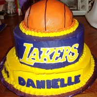 Lakers Basketball Cake Special request from a 10 year old girl wanted her team, number and a basketball on a stacked cake. All buttercream. Logo, name and number...