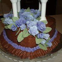 Wilton Course Iii Final Cake This is a close up of the gumpast flowers on the bottom tier of my cake. In the photo they look blue, but they are actaully purple.