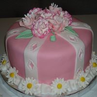 Wilton Fondant & Gumpaste Course Final Cake This is a strawberry cake covered in Fondant. The flowers are gumpaste. It was my first fondant cake.