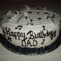 Musical Themed Birthday Cake Fudge Marble cake with Oreo Cookie filling and cream cheese frosting. Covered in fondant and decorated with fondant sheet music. This...