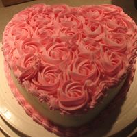 Valentine's Party Cake This is a 9" heart (french vanilla) with BC icing and covered in BC rosettes. For a coworker's daughter's daycare party. She...