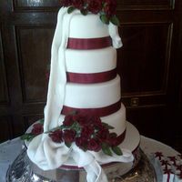 Vanilla Cream Wedding Cake (Sugar Paste) I baked a 4 tier wedding cake and made sugar roses. It took 2 weeks to complete the roses, the rosebuds and the and leaves. But I think it...