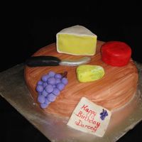 Cheese Board Made this today for a friends birthday. Cake is covered in MMF and then textured with a knife to resemble the wood grain and painted with...