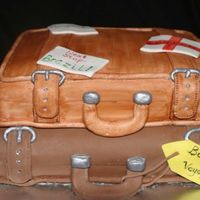 Bon Voyage! Made for a friend and her family who are relocating to Brazil. Top cake is all vanilla, bottom is chcolate, IMBC and red raspberry filling...