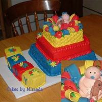 Baby Shower All iced in BC with fondant flower , baby is gumpaste.