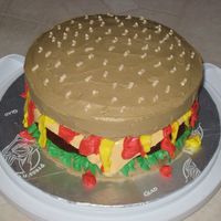 My First Hamburger Cake I made this for my son's 13th birthday. I kinda messed up with the "mustard" and "ketchup", but I think it turned...