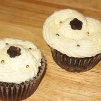 Birthday Cupcakes I had planned to make a huge topsyturvy cake for my niece's 16th. She wanted chocolate cupcakes. These have cheesecake in them....