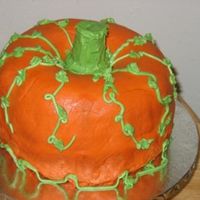 My Very First Pumpkin Cake I have to say Kudos to all that have made this cake! This is a monster to frost!! My top bundt is pumpkin spice and the bottom is DG Choco...