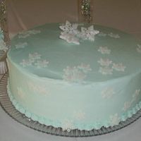 Light Blue Snowflake Wedding Cake Light blue buttercream with fondant snowflakes.