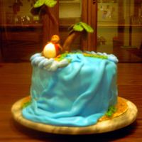 Curious George Banana cake with banana cream filling. Covered in fondant. Figures molded out of fondant. This was my first attempt at using fondant. It...