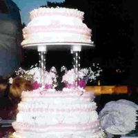 Cakes_035.jpg All buttercream. This was my first teired cake. I was trying a lot of different things; too much for one cake. The bride didn't care...