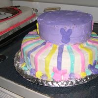 Easter Stripes This is a nice pastel colored cake with bunny heads on the sides and stripes all made out of fondany!