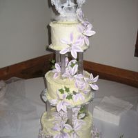 First Tiered Wedding Cake This is my first wedding cake using pillars :) it was for a friend. I def. learned quite a few things making it ( such as make sure the top...