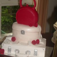 Handbag, Case All fondant , had trouble covering the handbag, first time doing this shape, an extra thin layer of fondant tidied it up, It was to go in...