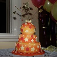 Stephanie Another 'old' photo. First time spray painting (Wilton can). Top made in small pudding mold.All fondant except topper, wooden...