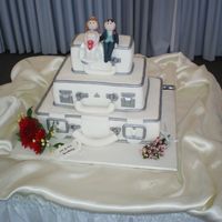 Imgp0173.jpg Brides Mum designed cake as a surprise for 2nd reception in Australia. GP Waratah spray purchased. 'Welsh spray' is gumpaste...