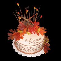 Autumn Birthday This cake was done for the mom of a man I work with. Marble cake, bc icing, silk flowers.