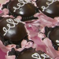 First Wedding Cake/cupcakes Chocolate cream-filled cupcakes with chocolate glaze and heart swirl. My take on the classic "Hostess" cupcake.