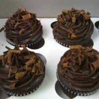Dark Chocolate Cupcakes Dark chocolate cupcakes with dark chocolate buttercream and chocolate curls. (Sorry for the crappy cell phone picture!!)