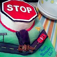 Stop Sign/cars Cake This was for a little boy turning 5 who is very into road signs and is having a Disney Cars themed b-day party. 2 10 inch yellow cakes iced...