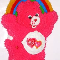 Dscn0900V2.jpg I did this cake for a coworkers niece. I was pretty happy with the cake but it was a humid day so it looks like the poor thing is melting...