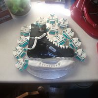 Hockey Skate Cake And Jersey Cookies My son had his hockey wind-up so this is what I came up with. He doesn't like cake so much which is why I did cookies as well. It...