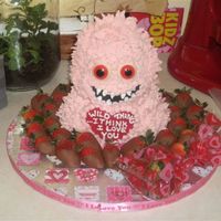 Valentine Wild Thing I got the idea from a Wilton website added the chocolate strawberries for fun the cake is a 3d bear pan and the heart is melted chocolate...