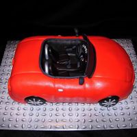 Convertible Miata My husband has 2cars, but his favorite is a convertible Miata he paid $500 for so I made a replica of it for his birthday. Car cakes don&#...