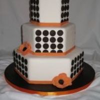 Geo Cake Hexagon dummy cake covered in fondant with gumpaste flowers and choc. fondant dots.