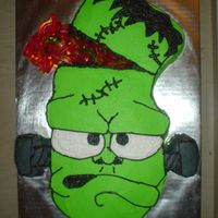 Franky Yellow cake, buttercream icing. The "brains" are gummi worms.