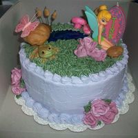 Tinkerbell Cake This is a child's birthday cake. Tinkerbell was originally made out of gumpaste but she didn't dry in time, so I had to settle...