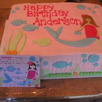 Mermaid Cake A mermaid cake to match the invitation...this cake was huge! Buttercream icing and fondant accents.