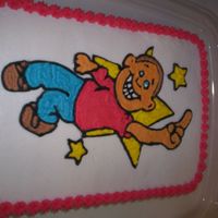 100_0423.jpg First cake I had ever decorated. Made with buttercream frosting.