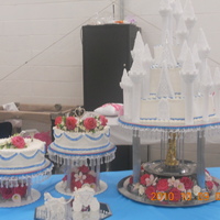 Castle Quince All buttercream cake with gumpaste flowers. Shoe server and tiara. Lots and Lots of flowers. Butter cream is so much harder to work with...