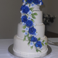 Blue Rose Ice Cream Cake My first ice cream wedding cake. Bettercream iced with gumpaste flowers.