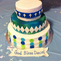Boys First Communion Fondant covered chocolate cake with chocolate pudding and yellow cake with strawberry filling.