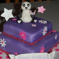 Purple And Pink Panda Cake Birthday cake for a 7 year-old. Loves purple and pandas. Airbrushed cake purple, dusted with silver pearl dust and added hot pink accents....